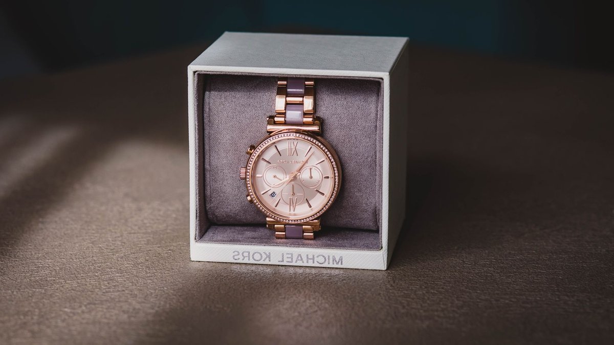 Close-up of a luxury rose gold watch in a stylish box, perfect for gifting.