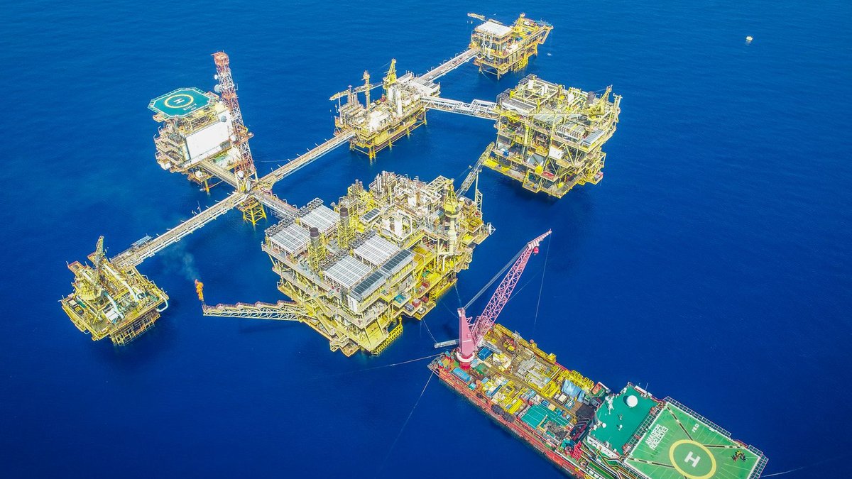 Chinese Turkish firms lead Bangladesh offshore bid interest Aerial shot of an offshore oil platform complex in the ocean, showcasing industrial infrastructure.
