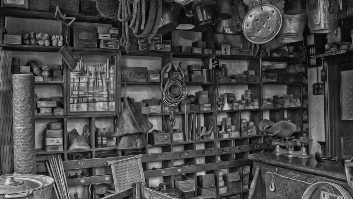 Monochromatic view of a vintage hardware store with assorted tools and kitchenware.