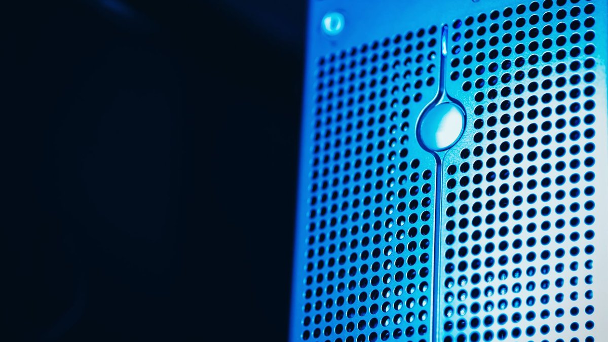 Fiserv overhauls core banking systems amid market struggles Modern server rack with blue lighting in a secure data center environment.