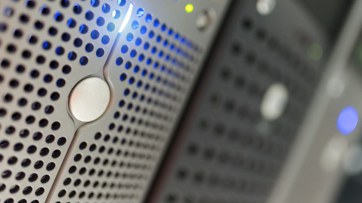 Anthropic signs lease for Nova Scotia data centre Focused detail of a modern server rack with blue LED indicators in a data center.