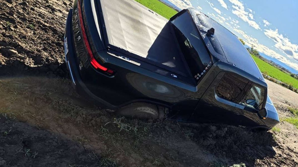Rivian R1T Stuck in Clay, Fire Truck Also Stuck - rivian r1t stuck