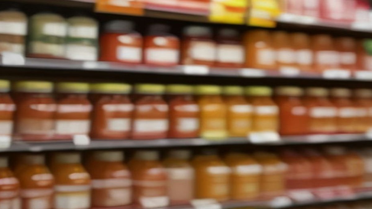 Perelló adds Spanish pantry range to UK shelves Spanish sauce bottles on supermarket shelf.