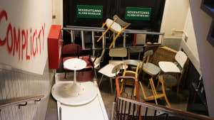 Read back | Building empty, but full of barricades and graffiti on walls