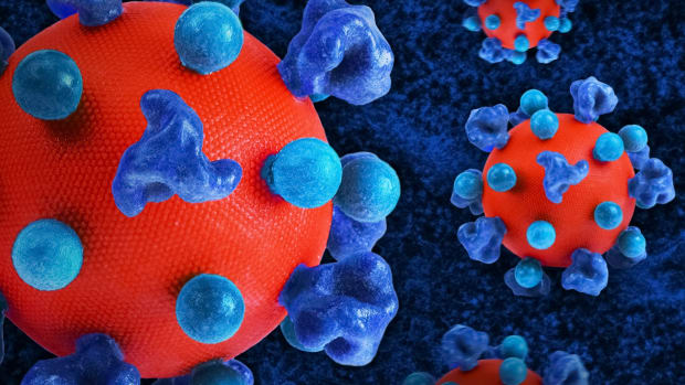 De oppervlakte van het hiv-virus (rood), bedekt met prote&iuml;nen (blauw).