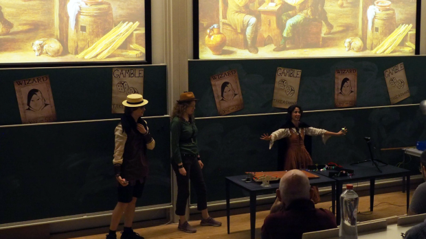 The wizard&rsquo;s assistant demonstrates an experiment in The Science of Magic.