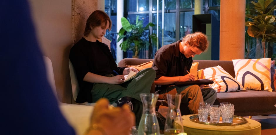 Students participate in a writing assignment on family history in VOX-POP