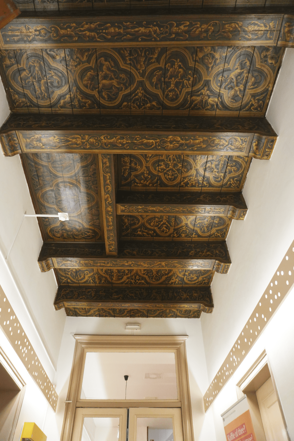 The beamed ceiling in the entrance hall of the University Theater