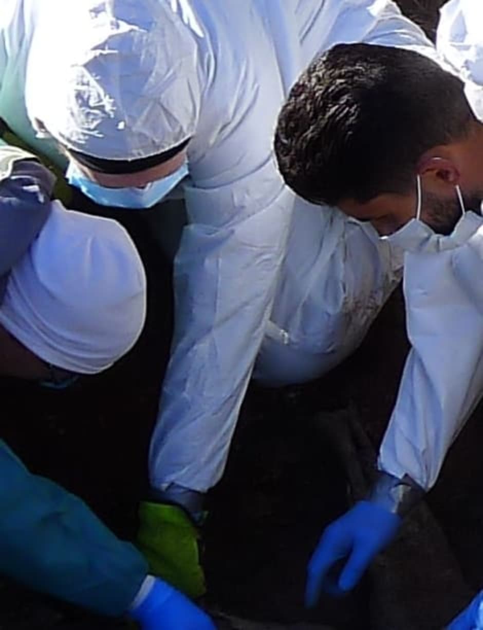 Hayley Mickleburgh studies excavating a mass grave