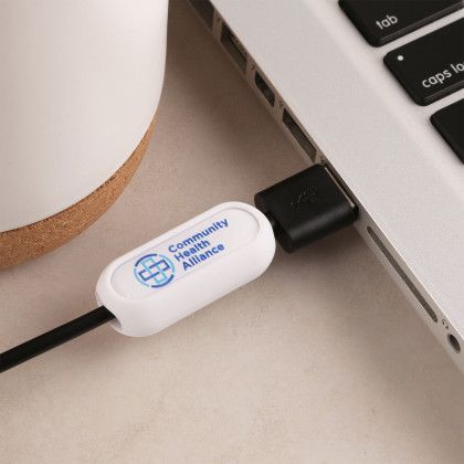Custom Cordstop Cable Protector - White In Use Custom Cordstop Cable Protector - White In Use