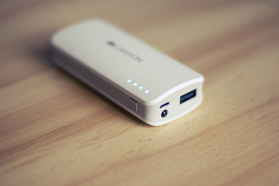 A white power bank on a table