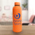 Custom 17 Oz Double Wall Stainless Steel Bottle With a Rubberized Finish - Orange Lifestyle View 