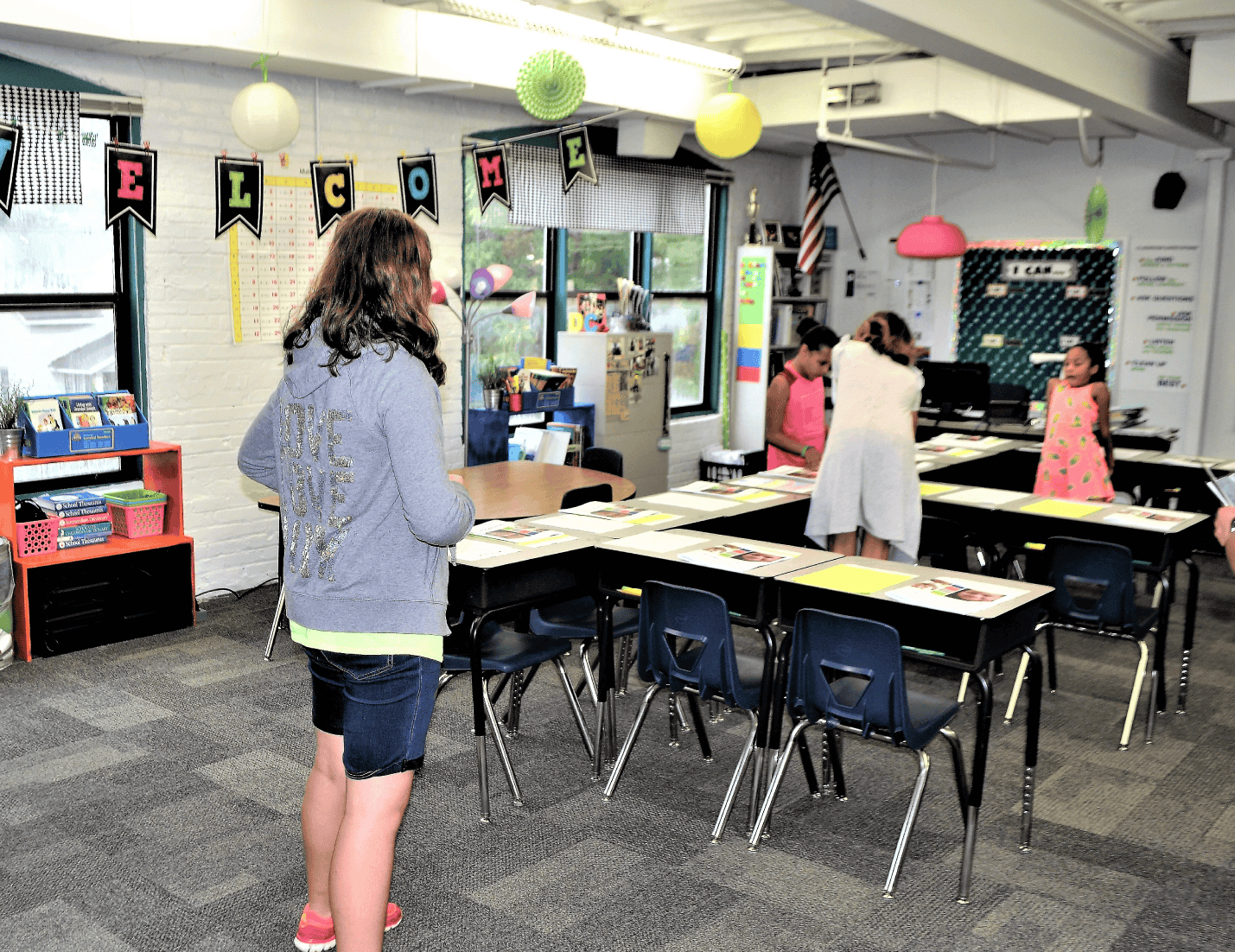 Students being welcomed back to school after summer break