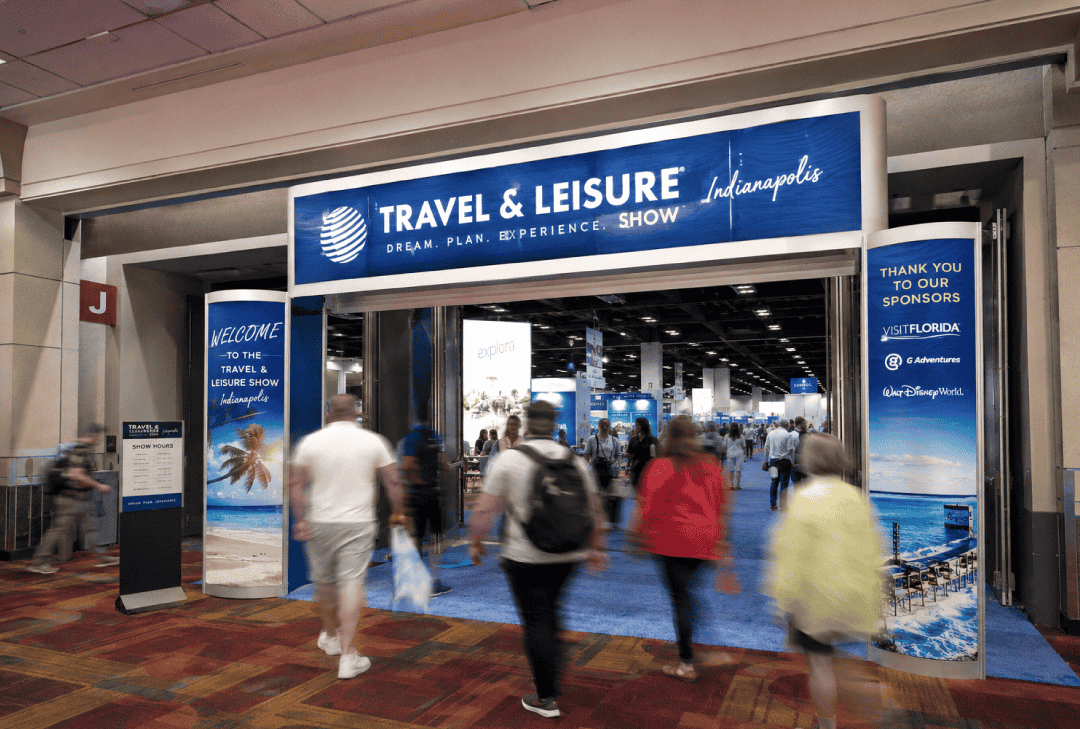 Attendees walking into a trade show