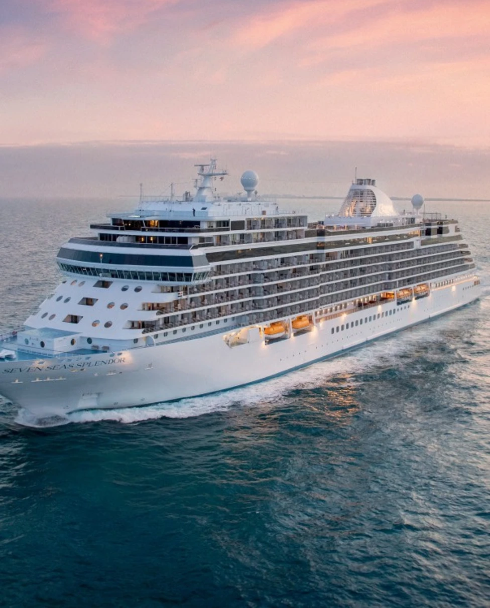 a white cruise ship on the open sea