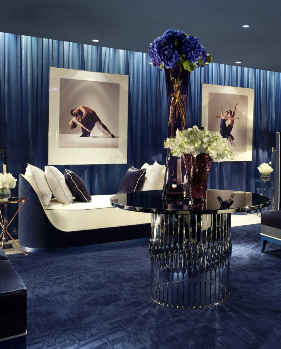 handsome spa waiting room with navy blue accents and fresh flowers