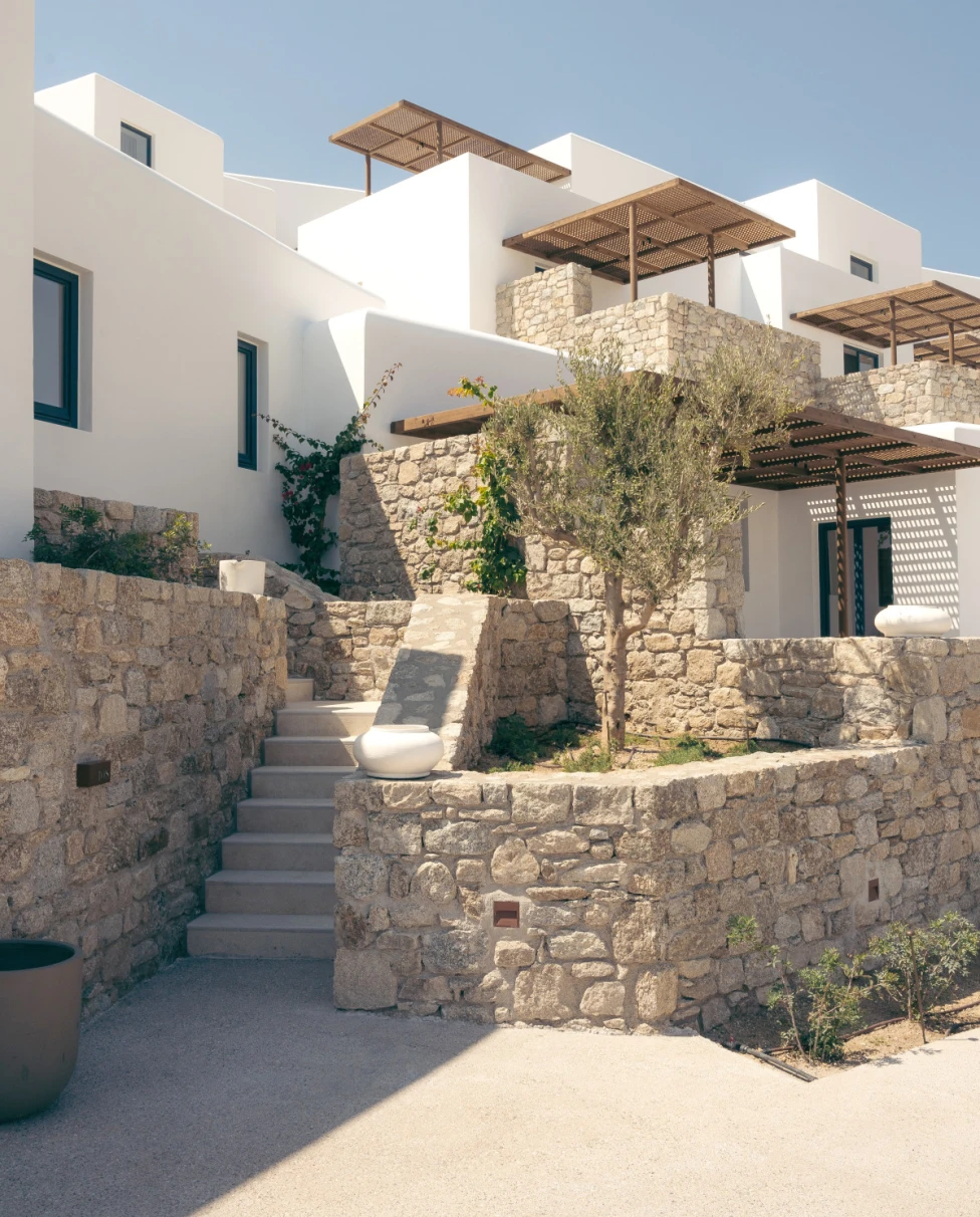 a stylish white and gray square building on a sunny day