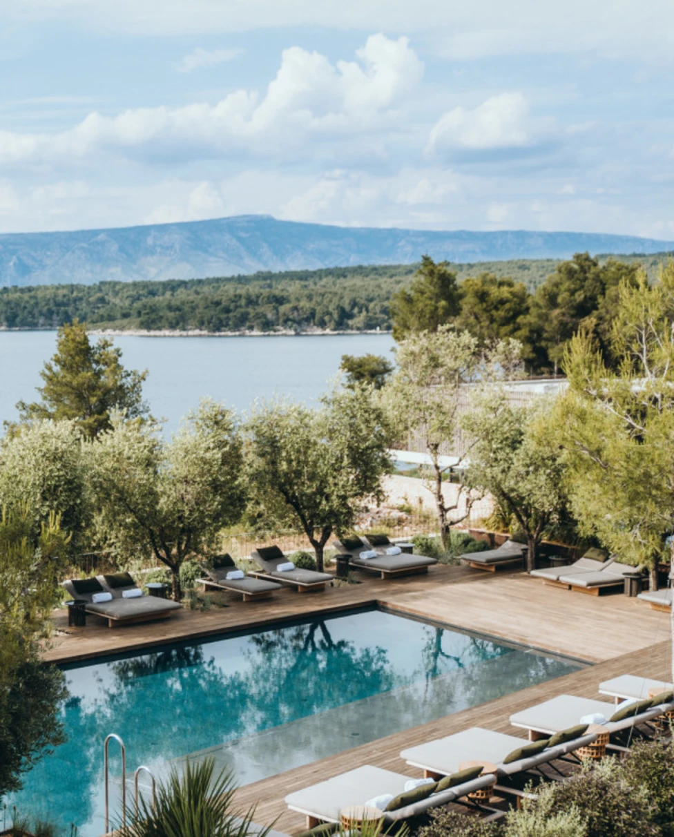 aerial view of a pool overlooking a lake