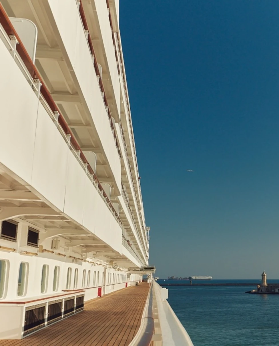 view of a wooden cruise ship deck overlooking the sea