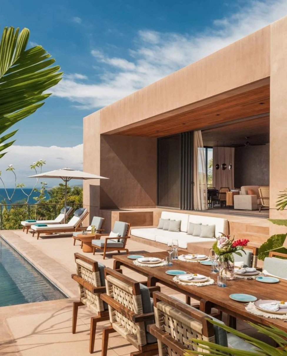 sand-colored villa with a terrace and an infinity pool