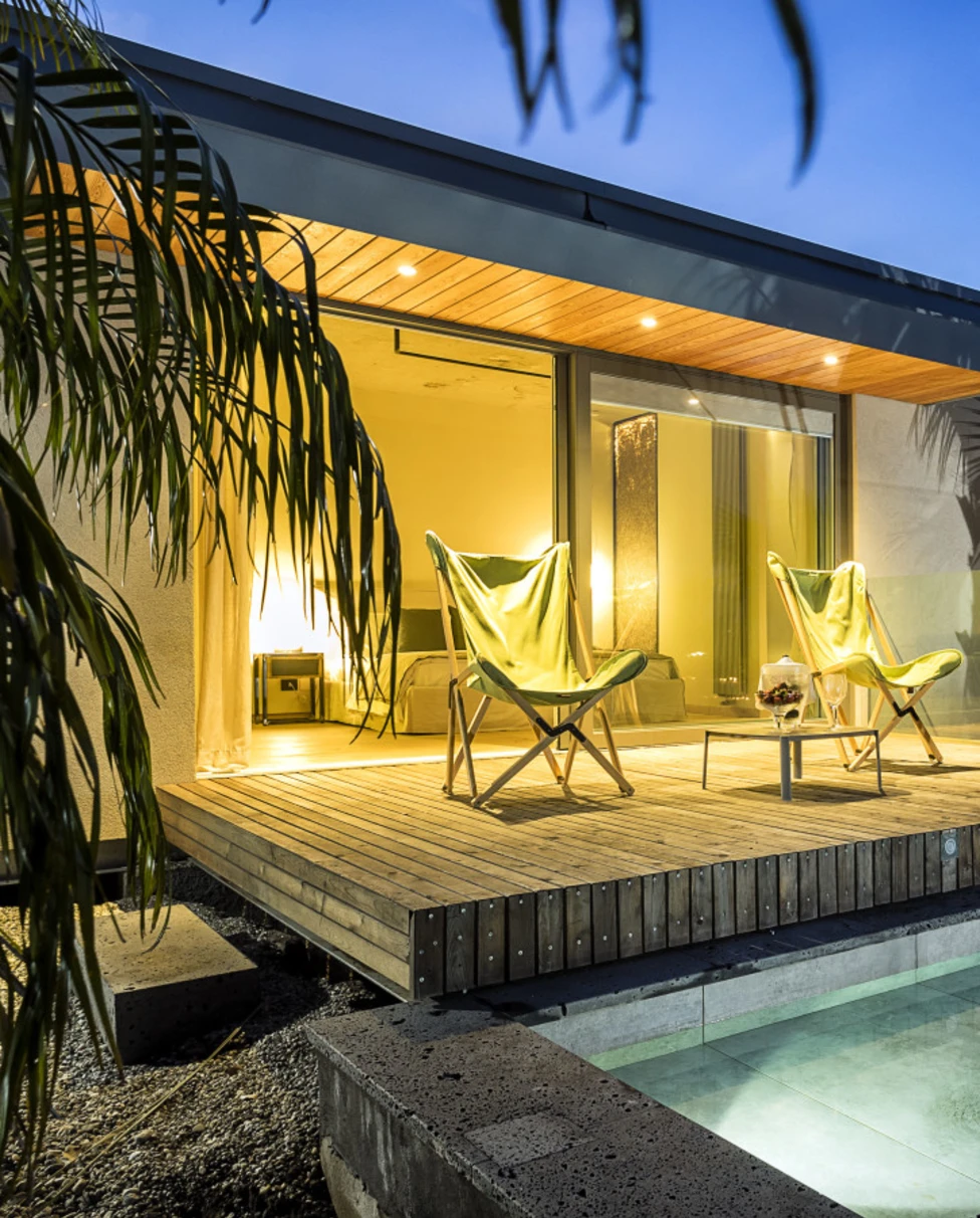 two chairs on a deck with a private plunge pool