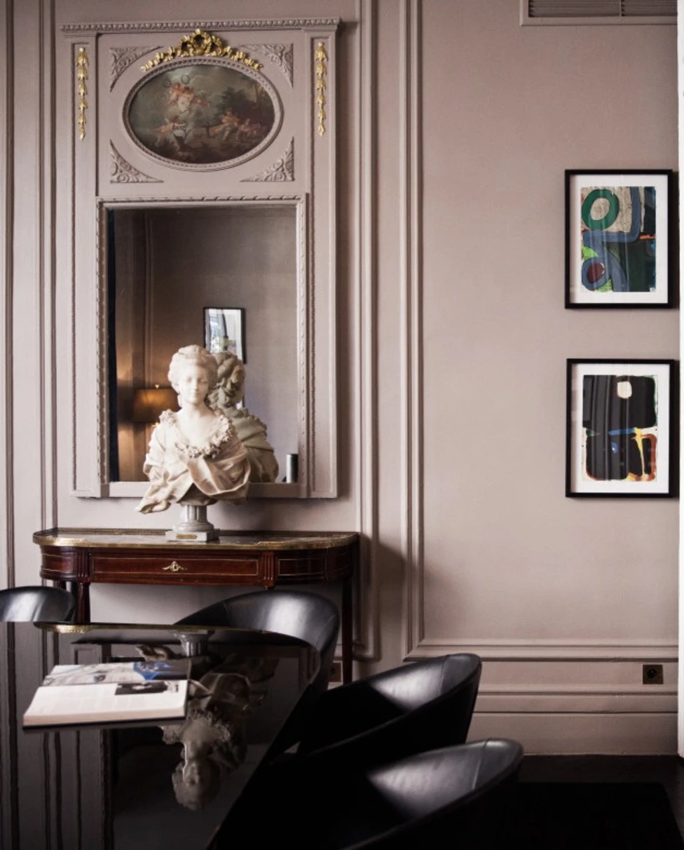 living room with a white marble bust of a woman