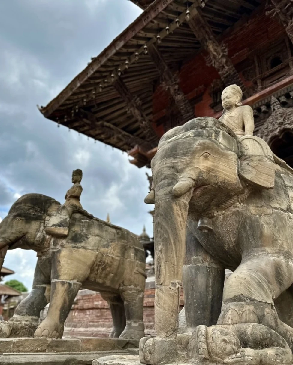 stone elephant statutes underneath a temple