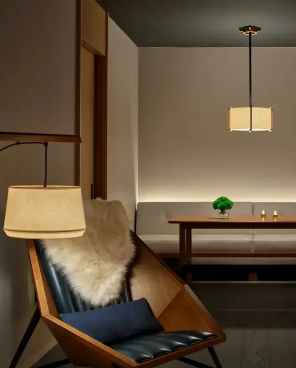 a geometric chair near a lamp in a sleek room