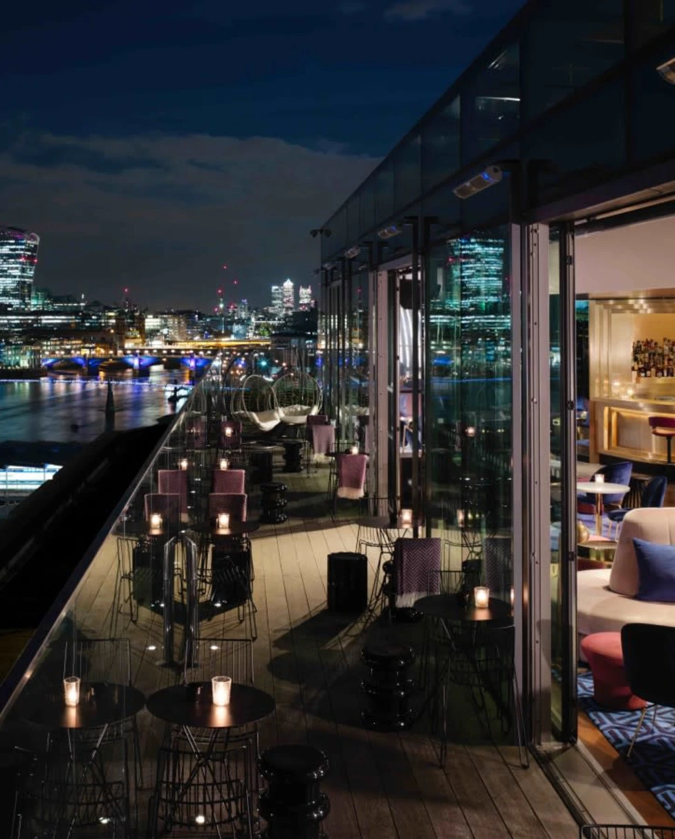 A view of the River Thames London skyline from the balcony at the Sea Containers hotel in London, taken at night.
