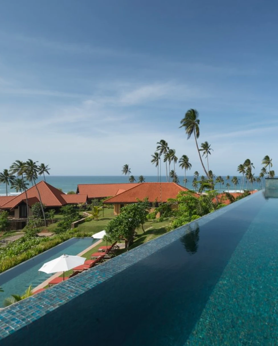 an infinity-edged pool overlooks the ocean