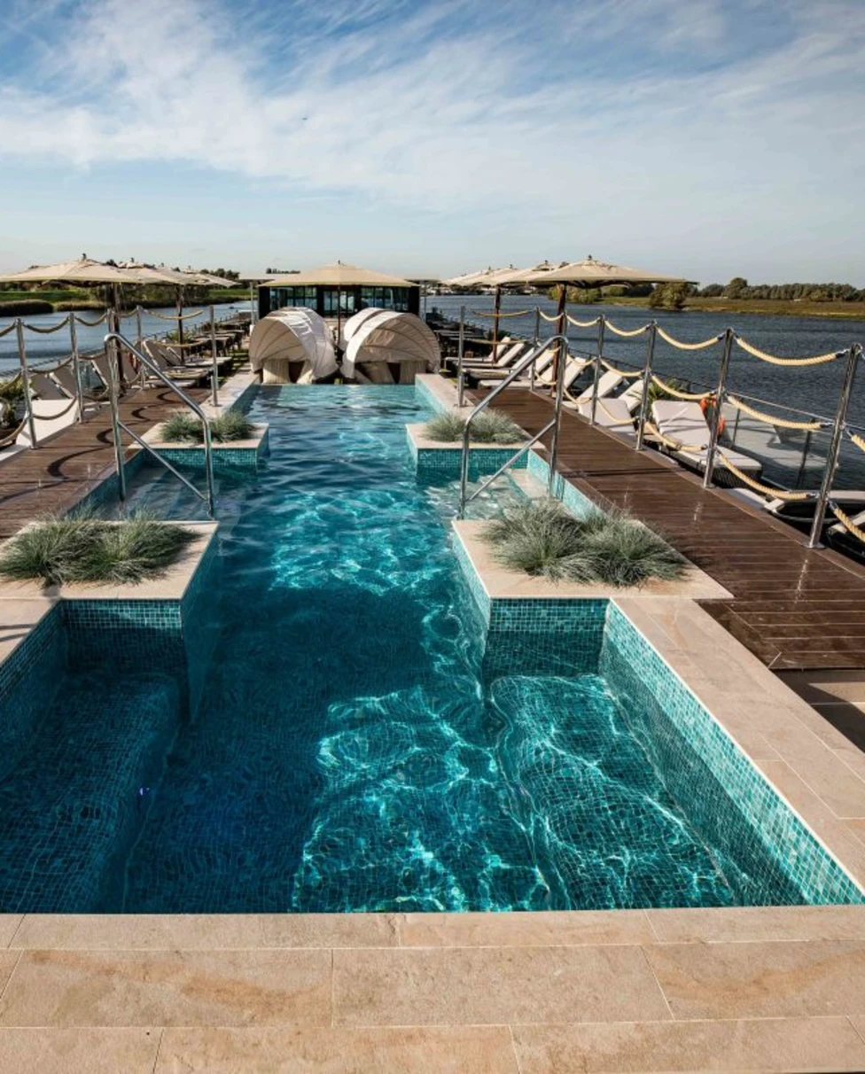 a long pool on a sunny cruise deck