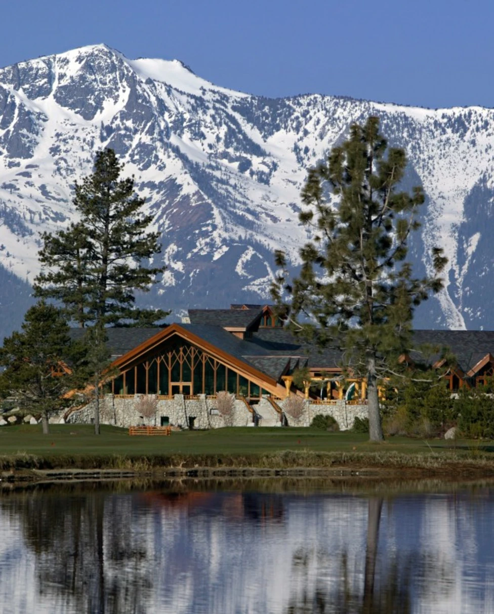 Edgewood Tahoe Resort exterior with lake and snow-capped mountains.