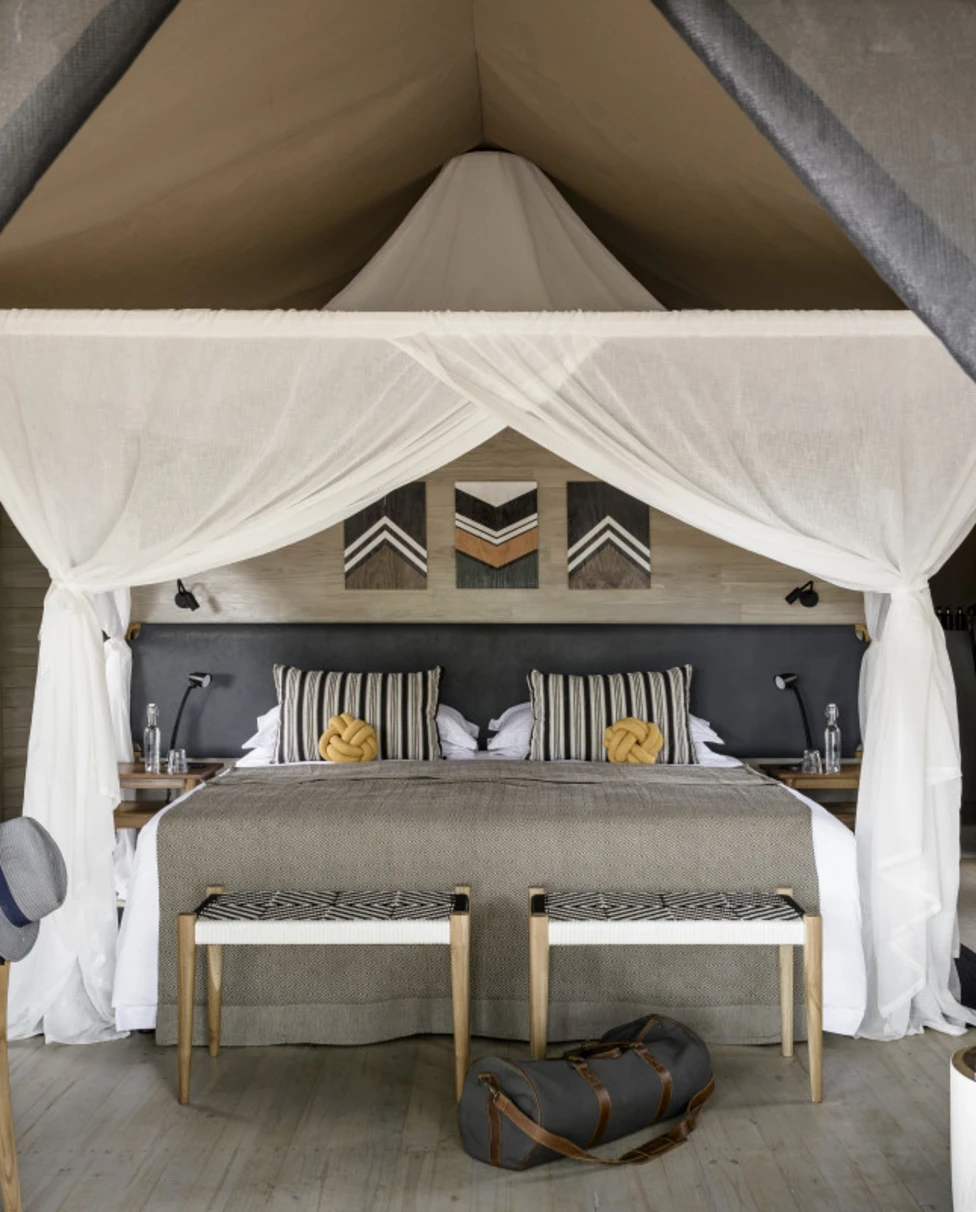 four-poster bed in a luxe safari tent