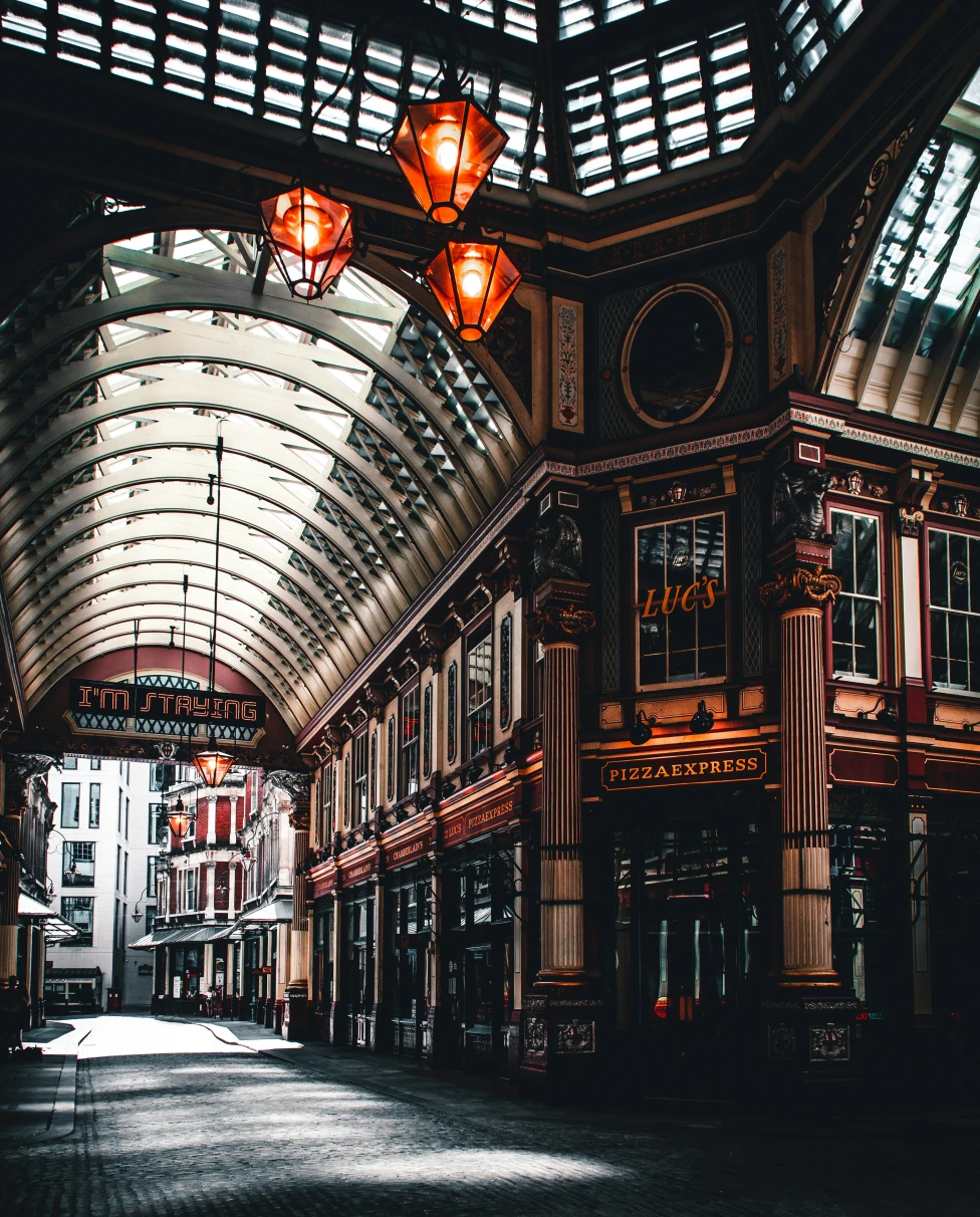 The inside of London marches, with tall ceilings and a curved glass ceiling