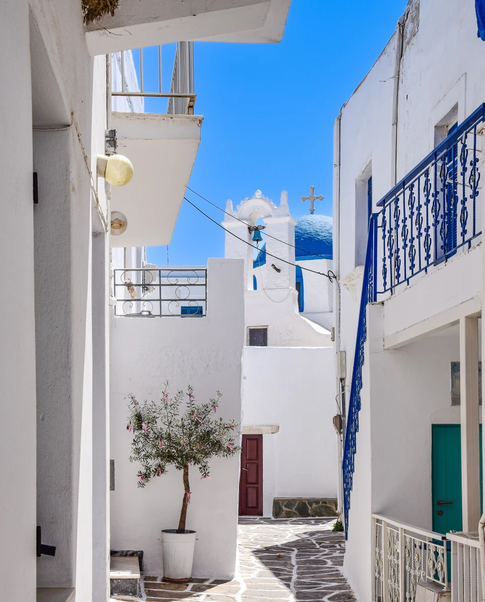 white building overlooking body of water