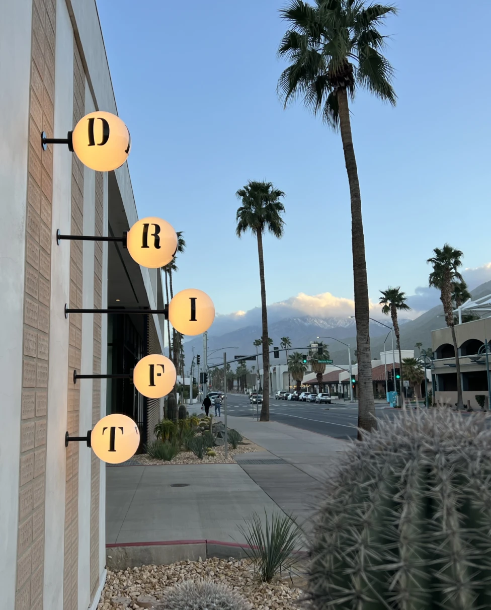 illuminated bulbs with letters on them that spell "Drift"