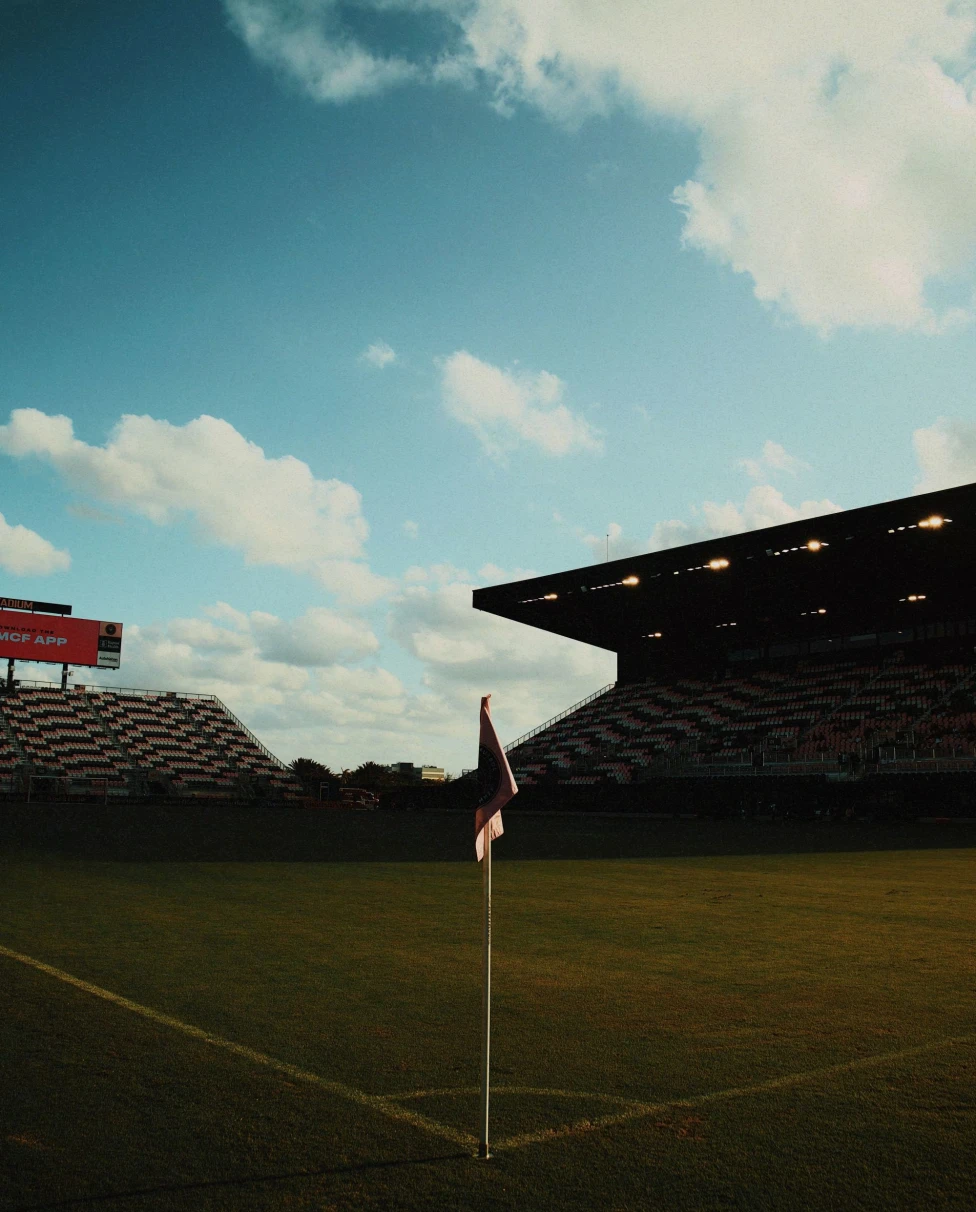 corner of a soccer field with flag at dusk