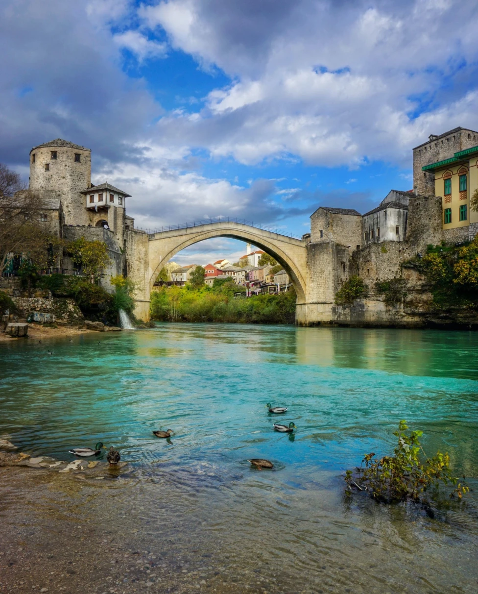 An old bridge over a river.