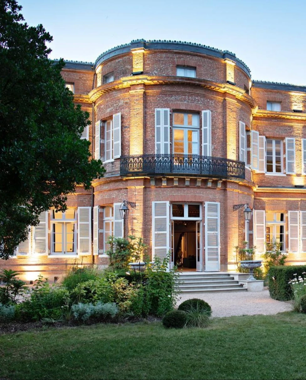 A majestic and historic castle nestled in scenic surroundings providing an exquisite retreat for guests.