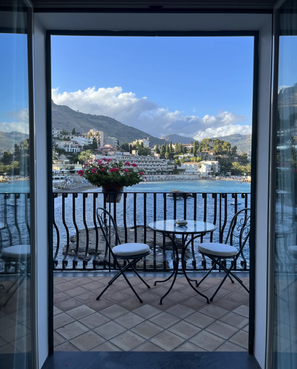 Balcony of a hotel looking out on a body of water