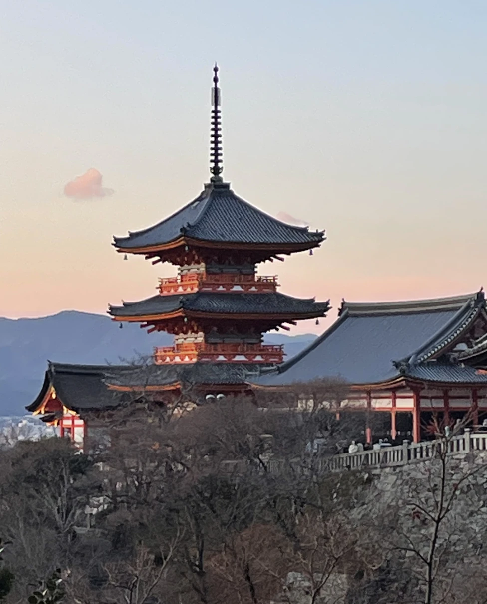 Kiyomizu-dera Temple in Kyoto in front of a sunset sky