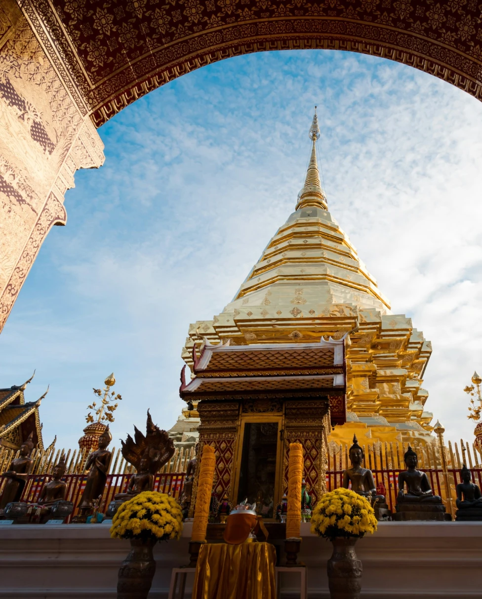 The outside of a temple building against a blue sky