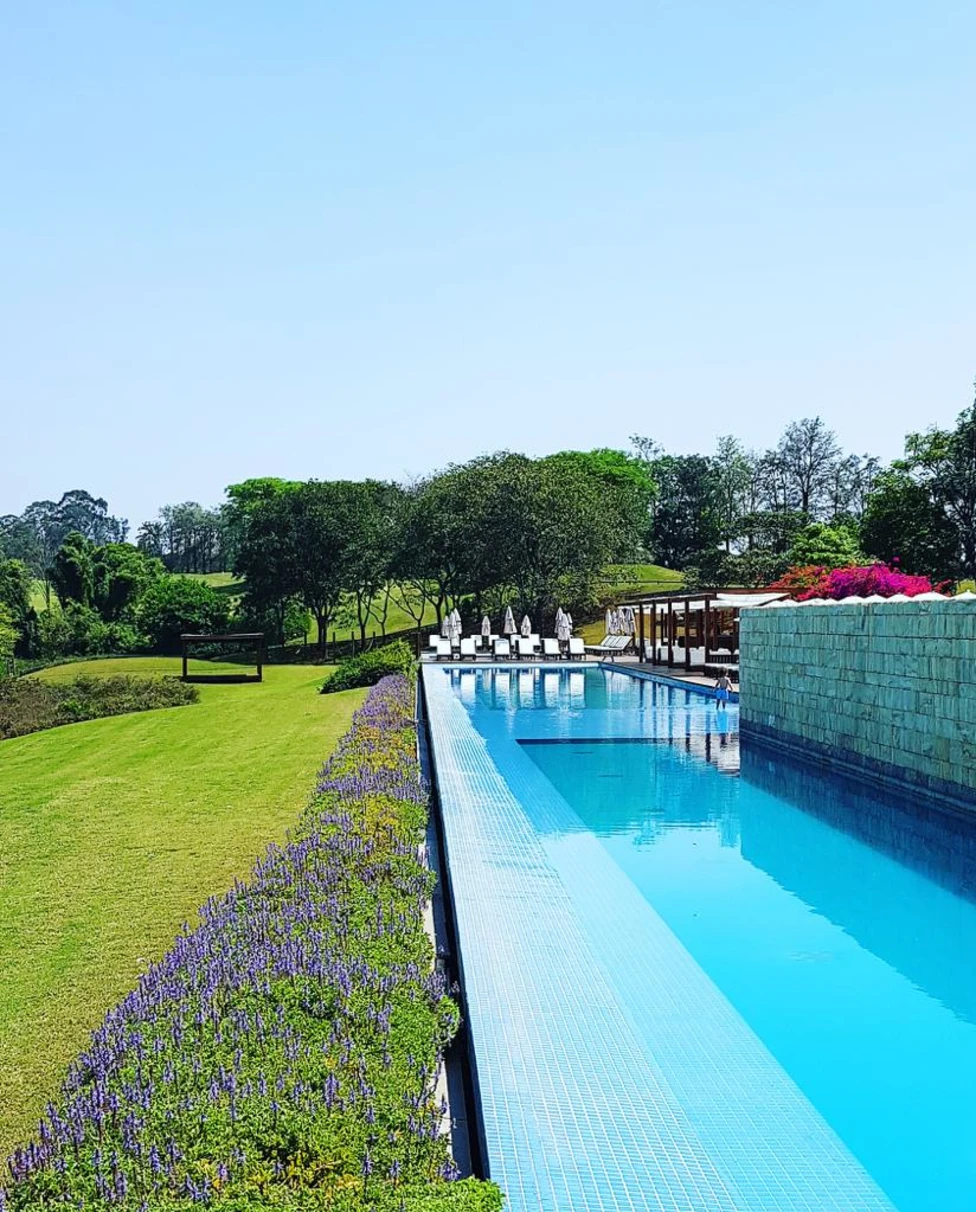 A resort with pool and garden.