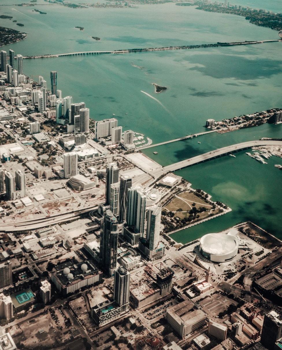 An arial shot of  Fort Lauderdale with high rise buildings on the seashore.