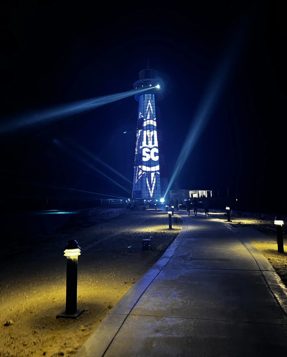 A picture of Cay lighthouse show during nightime