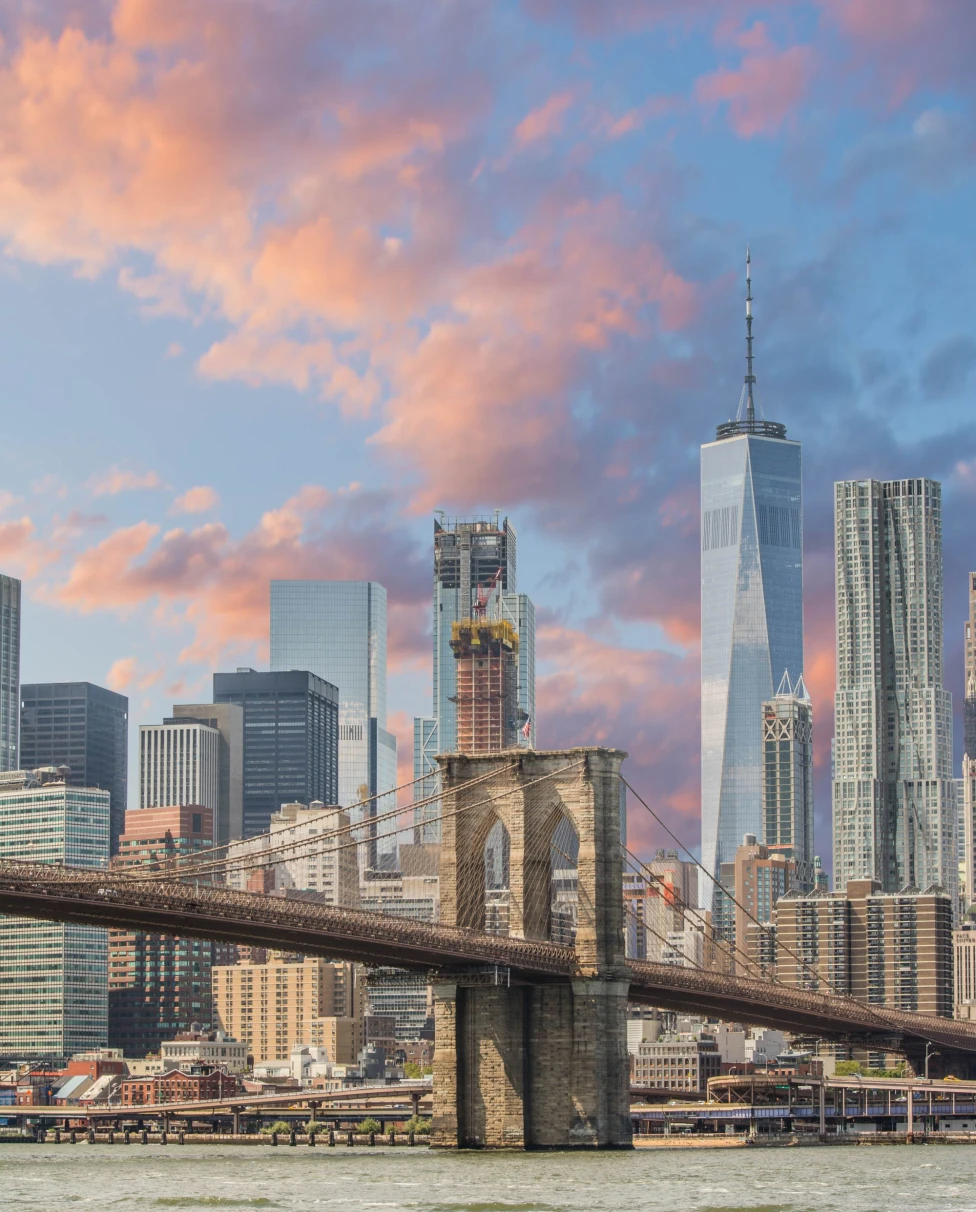 a bubble gum colored sunset over the Brooklyn Bridge