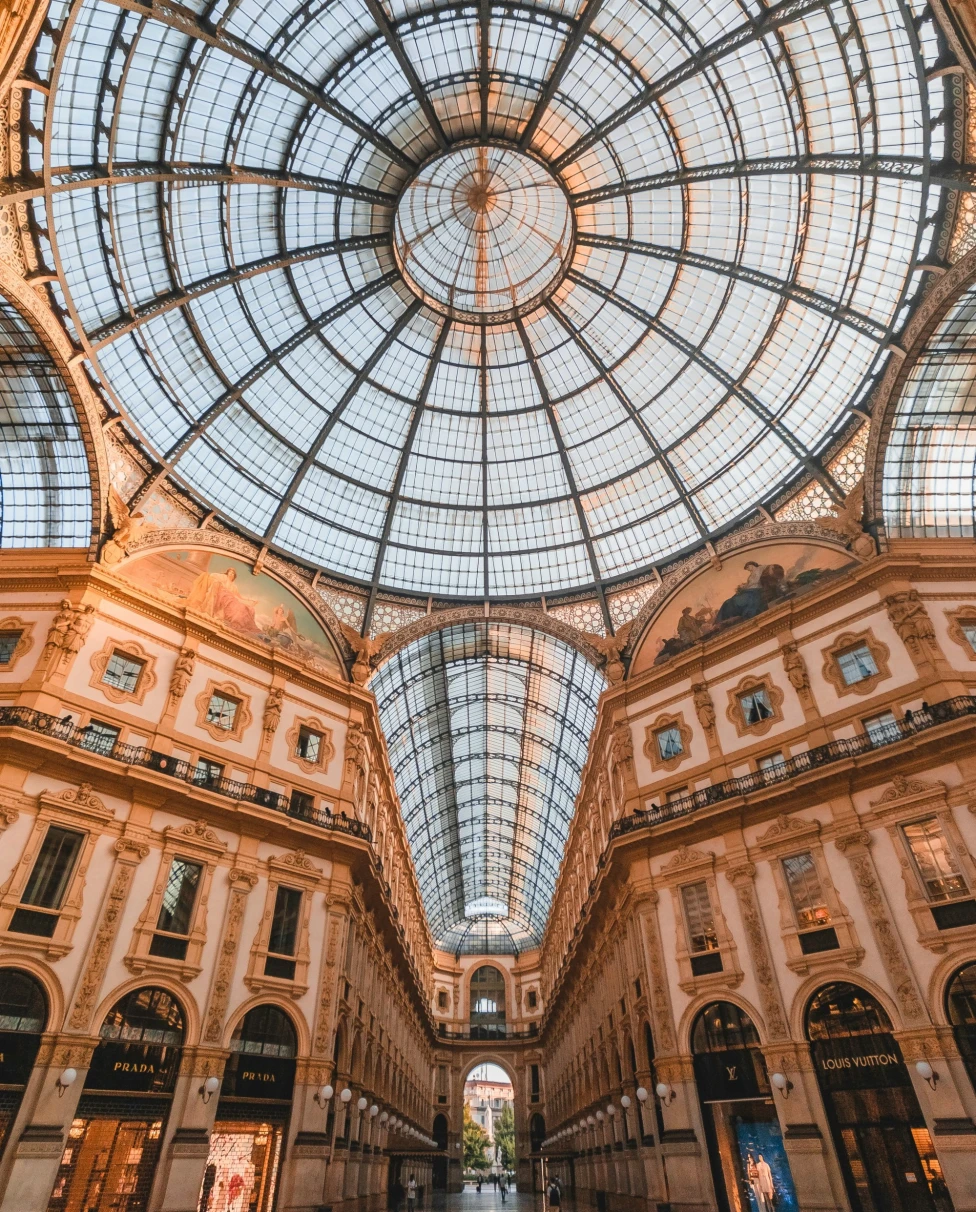 An aerial view of a building ceiling with ancient artwork,