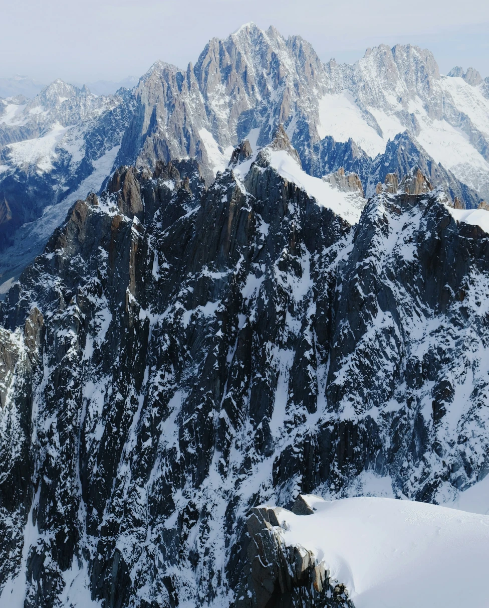 The French Alps on a sunny day with a breathtaking view of a mountain range.