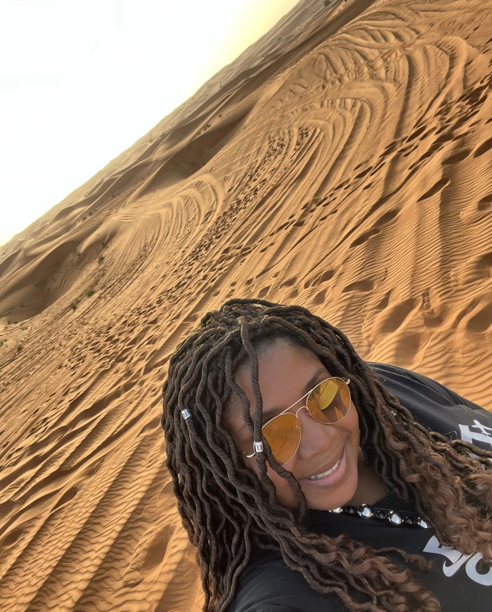 Woman taking a selfie in a desert.