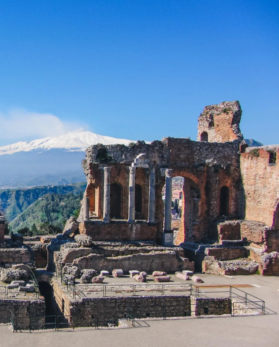 ancient outdoor theater made of stone at the top of a mountain range